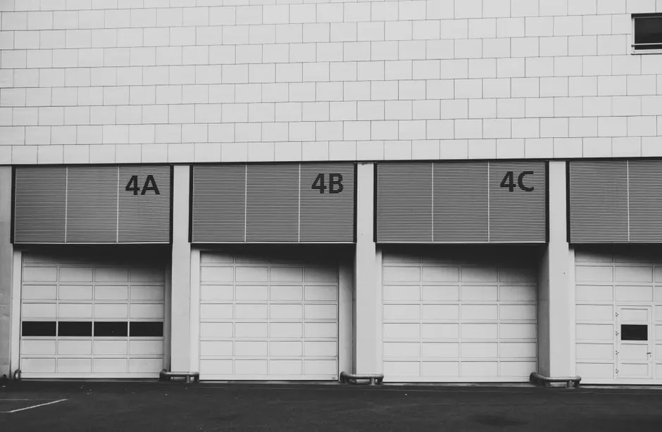 Monochrome image of three adjacent industrial loading docks labeled 4A, 4B, 4C.